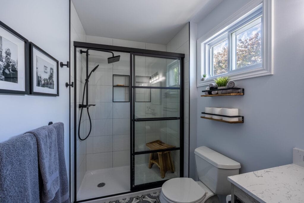 acrylic base tiled walls schluter niche black hardware miracle dream homes bathroom renovation