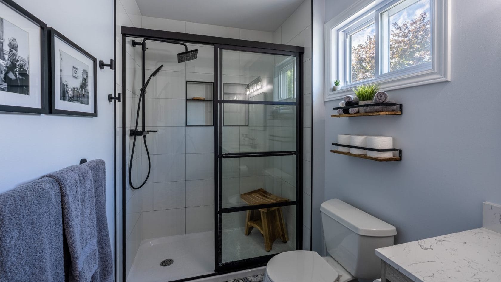 acrylic base tiled walls schluter niche black hardware Basement Bathroom renovation in Bells Corners
